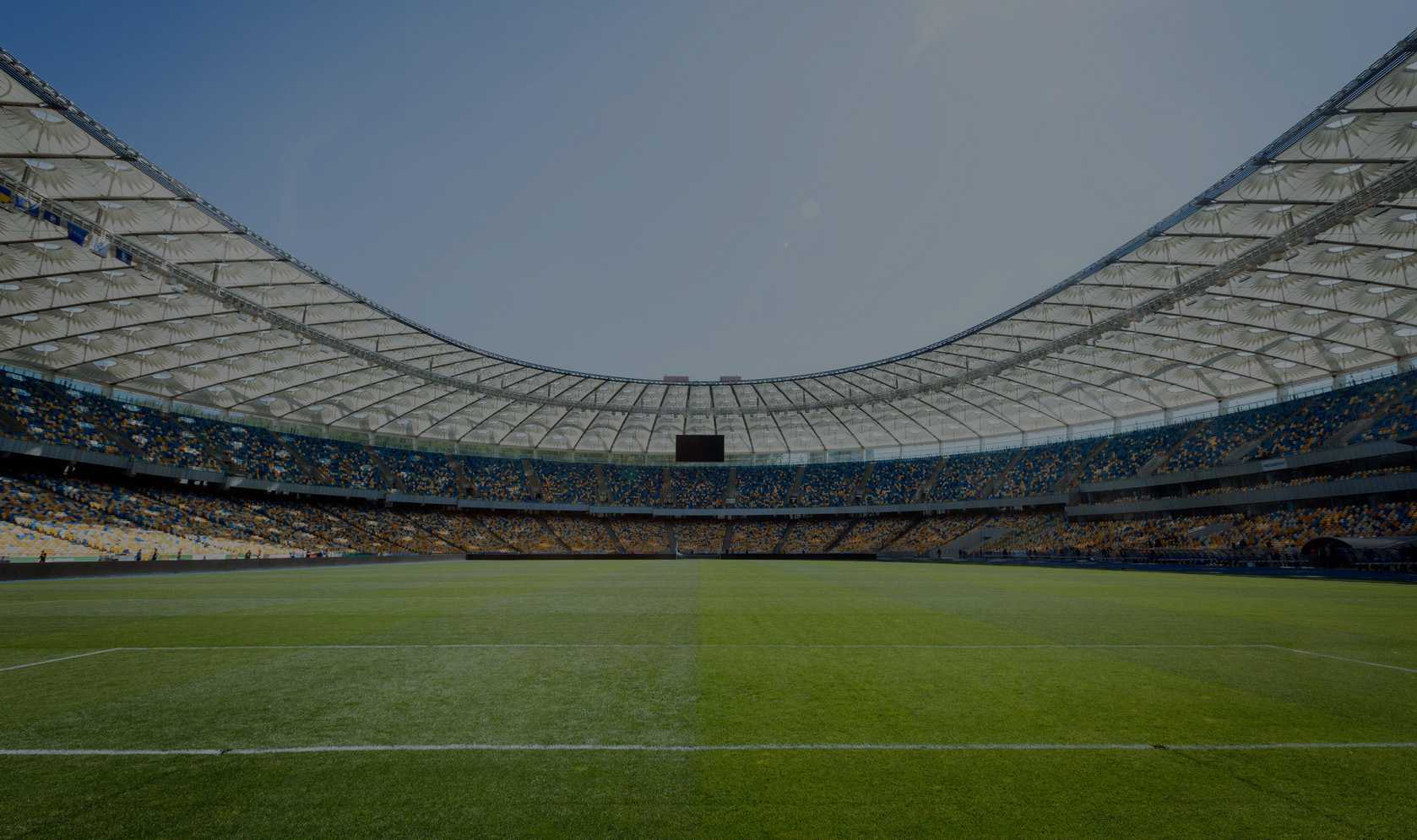 View across the pitch and stands of a football stadium