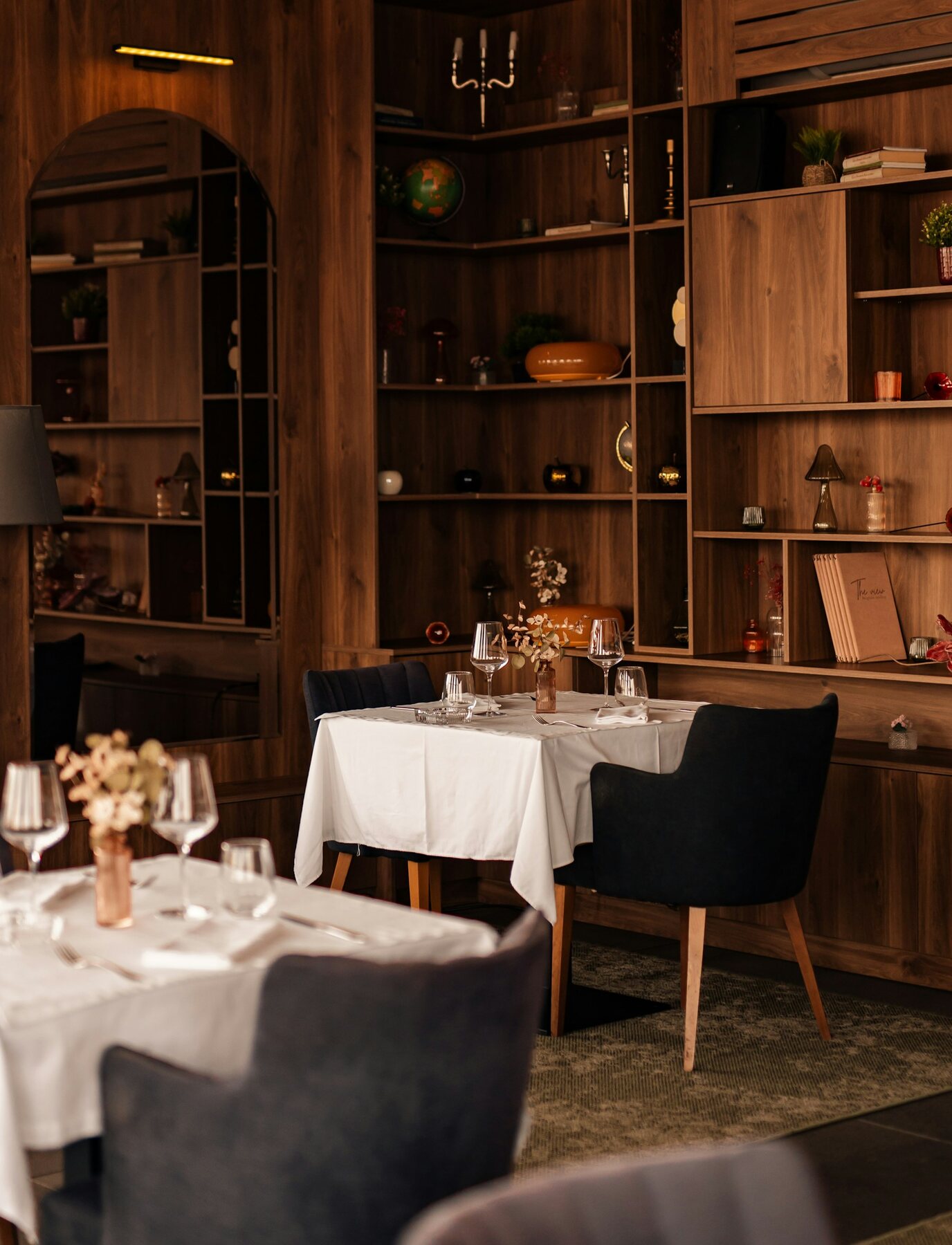 Elegantly set tables inside a restaurant