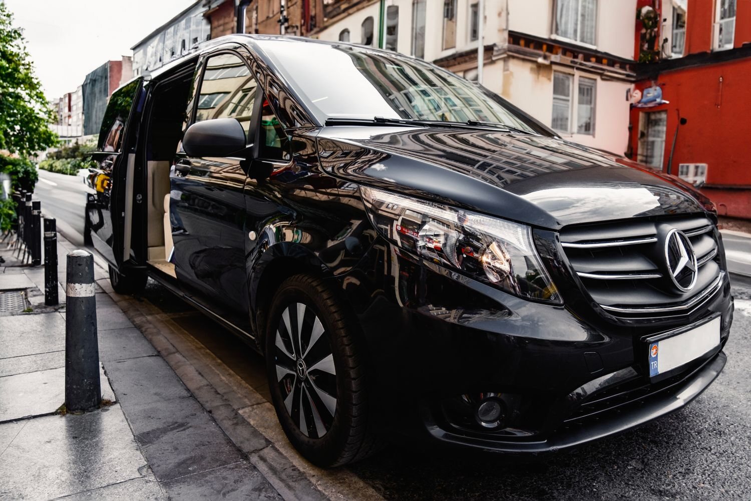 Black Mercedes-Benz V-Class with its sliding door open